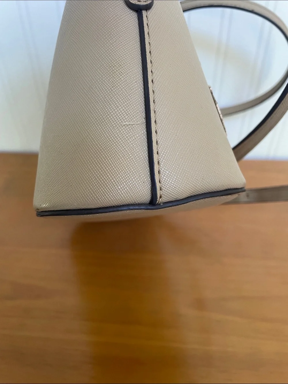 Kate Spade tan crossbody with floral, butterfly and fruit accents